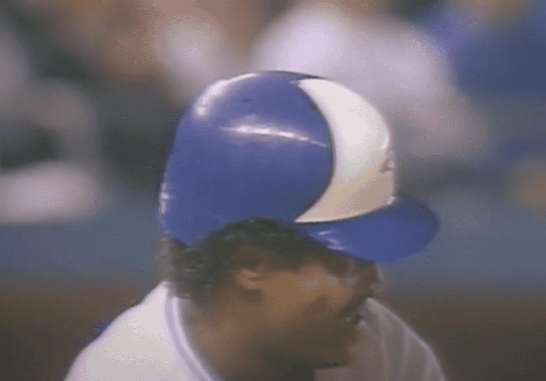 George Bell swinging a bat, representing the legacy of Blue Jays legends.